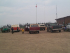 A few more vehicles waiting at the airport.