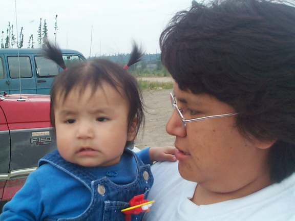 Auntie Joyce, holding her niece, Brianne Keewaykapow.  One of the few babies who will be going out.