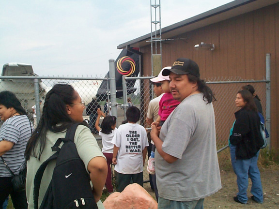 Gary Kakekagumick holds his daughter before she leaves.  Her common law, Maryanne will be going with her.