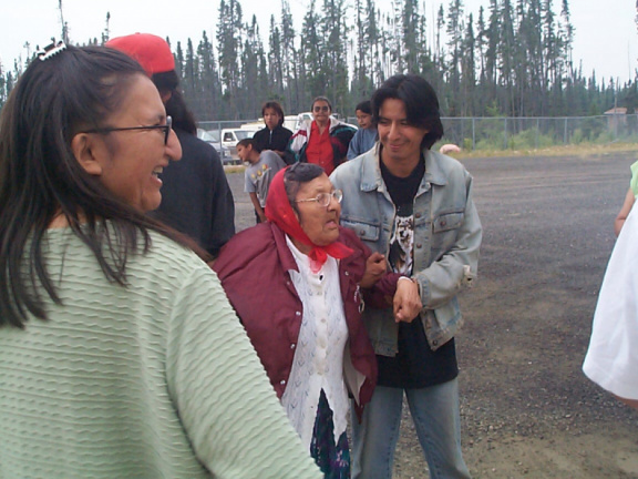 Our elder, Nancy Linklater receives help from Derek Kakegamic.