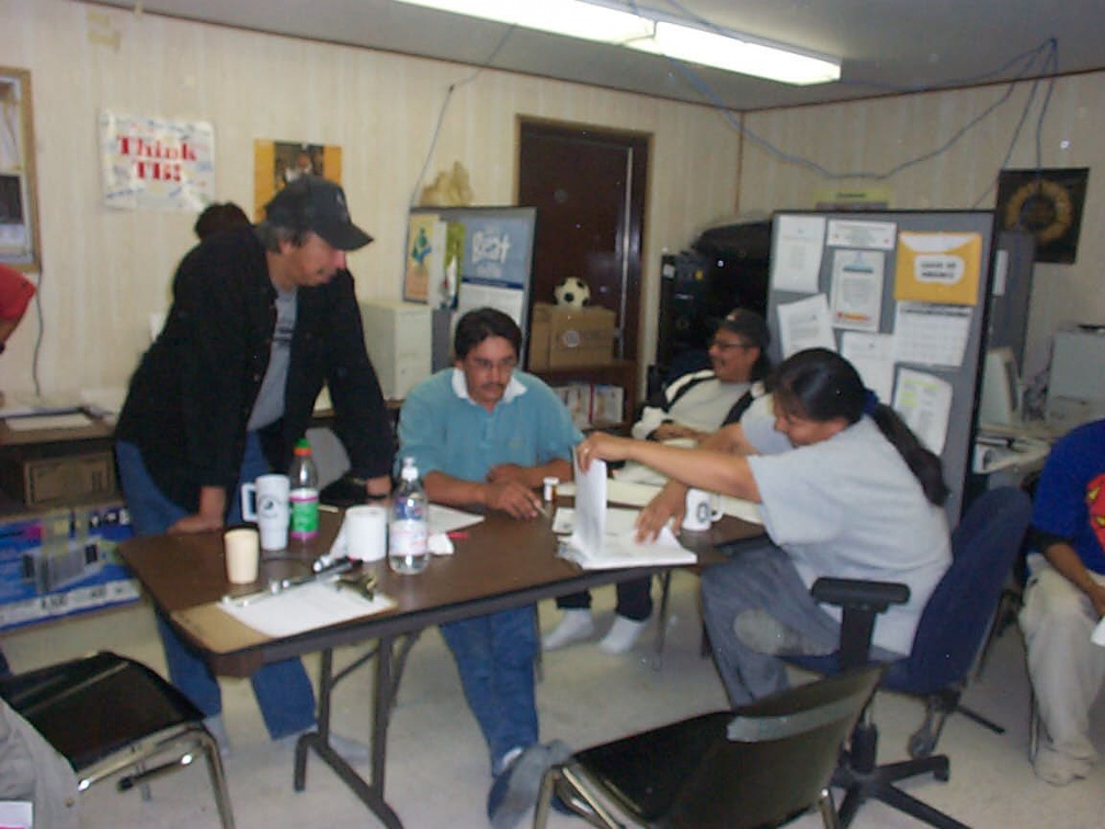 Raymond Meekis, Roland Pemmican, Bert Rae and Jill Quill discussing the situation concerning the people