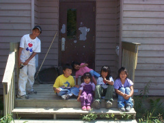 These kids are waiting for the door to be opened for bible school.