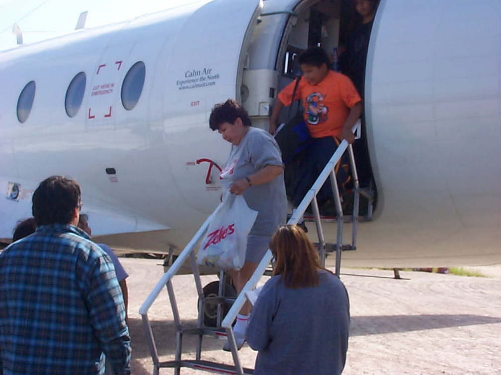 Marina Crowe and her son Randell Crowe getting off the plane