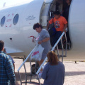 Marina Crowe and her son Randell Crowe getting off the plane