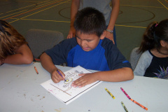 Frank coloring his picture.