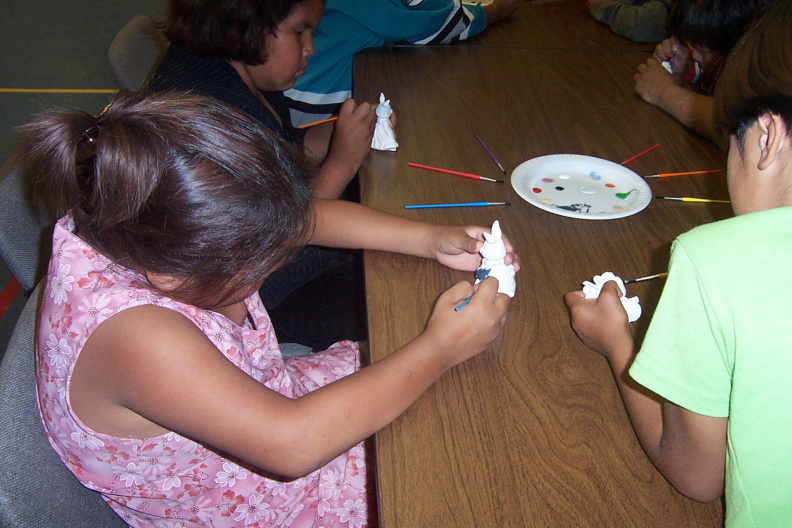 Emilyanne painting ceramics.