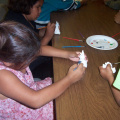 Emilyanne painting ceramics.