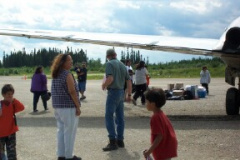 Nancy Kakepetum on the left. and Lee looking on. I bet u the plane was just loaded with goodies.
