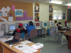 Some of the students are doing work on their computers.