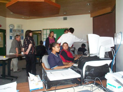 Another view of the internet high school in Keewaywin and a picture of some students working.
