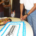 Oscar does the honors of cutting the cake