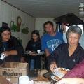 Another view of people making dinner plates