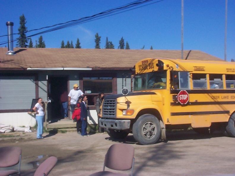 Students of David Meekis Memorial School arrive by the school bus