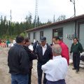 Mr. Nault shakes hands with a local elder