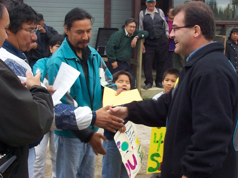 Chief Royal Meekis and Mr. Nault exchange greetings