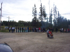 outside, people stay in line to get something to eat