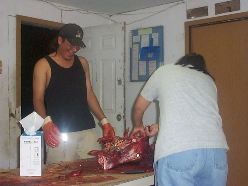 here is carol cutting up the meat and Andy looking on