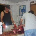 here is carol cutting up the meat and Andy looking on