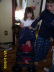 Matthew doesn't like Rebecca's doll stroller.