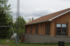 Side View of the back.  There's a big white dish and a tower behind the school.