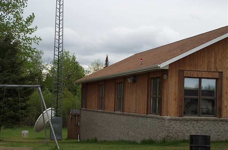 Side View of the back.  There's a big white dish and a tower behind the school.