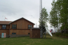 A view of from behind and of the dish and tower.