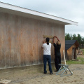 Cal Kenny and Ron Michitimy bolting the mount base to the south wall of the school.