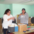 One of the RMO administrators showing the grade 4 - 8 teacher, Paula Armstrong how to make her own network cable.