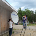 Barb and Cal working on the two way satellite!