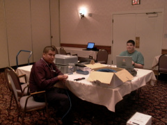 Harvey Yesno and Terry Moreau setting up the Internet Cafe