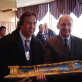 Prime Minister Paul Martin being presented with a gift from Peter Campbell, Public Works Manager, Keewaytinook Okimakanak