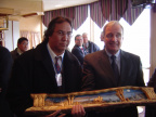 Prime Minister Paul Martin being presented with a gift from Peter Campbell, Public Works Manager, Keewaytinook Okimakanak
