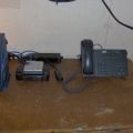 Ka satellite modem (left) wireless router equipment and Cisco IP telephone