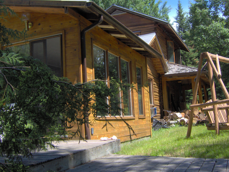 The front of the house from the walkway that crosses the stream