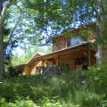 The front of the house from the trail up from the lake