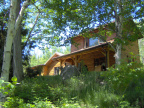 The front of the house from the trail up from the lake