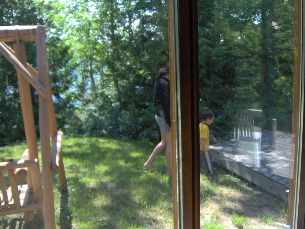 Serena and Jordan going over to the walkway/side porch from inside the house through the dining room window