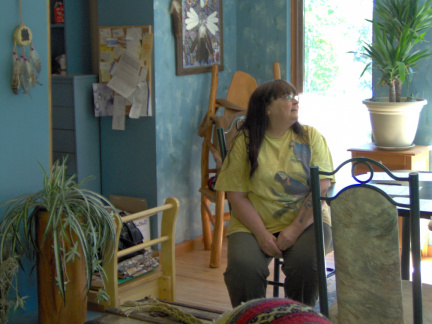 Sandy Buck, the current owner, in her living room