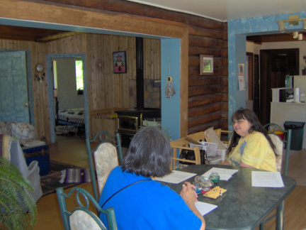 The dining room, living room, bedroom and kitchen from the corner of the dining room