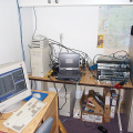 A DOCSIS cable plant on one table. The Cable Network Registration server is to the left with a number of cable modems on top.
I