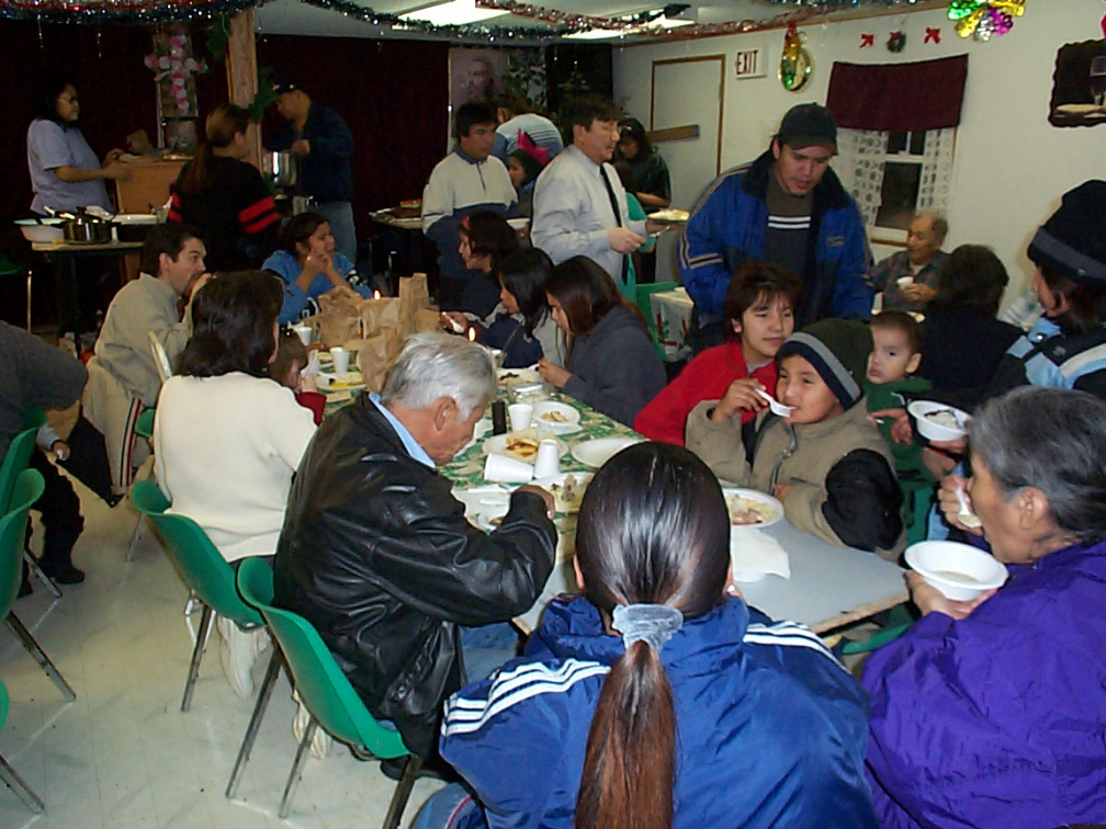 In the background are the church people serving the community members.