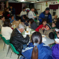 In the background are the church people serving the community members.