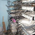 Behind the cable equipment racks.