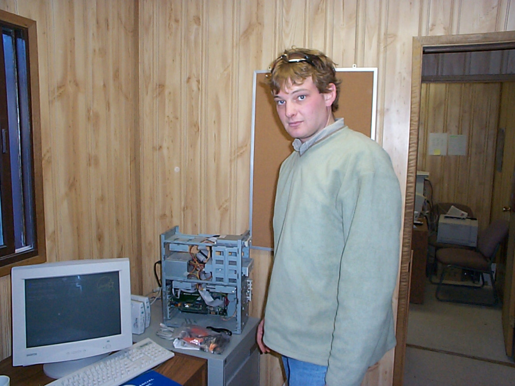Lars doing surgery on Archie Meekis' computer at the band office. 