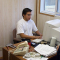 Corey Meekis working at his desk.