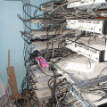 Behind the cable equipment racks.