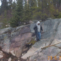 Desmond Meekis searching among the rocks.