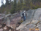 Desmond Meekis searching among the rocks.