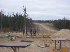 Raising the teepee in preparation for our picnic after clean up. YUMMEEE...
