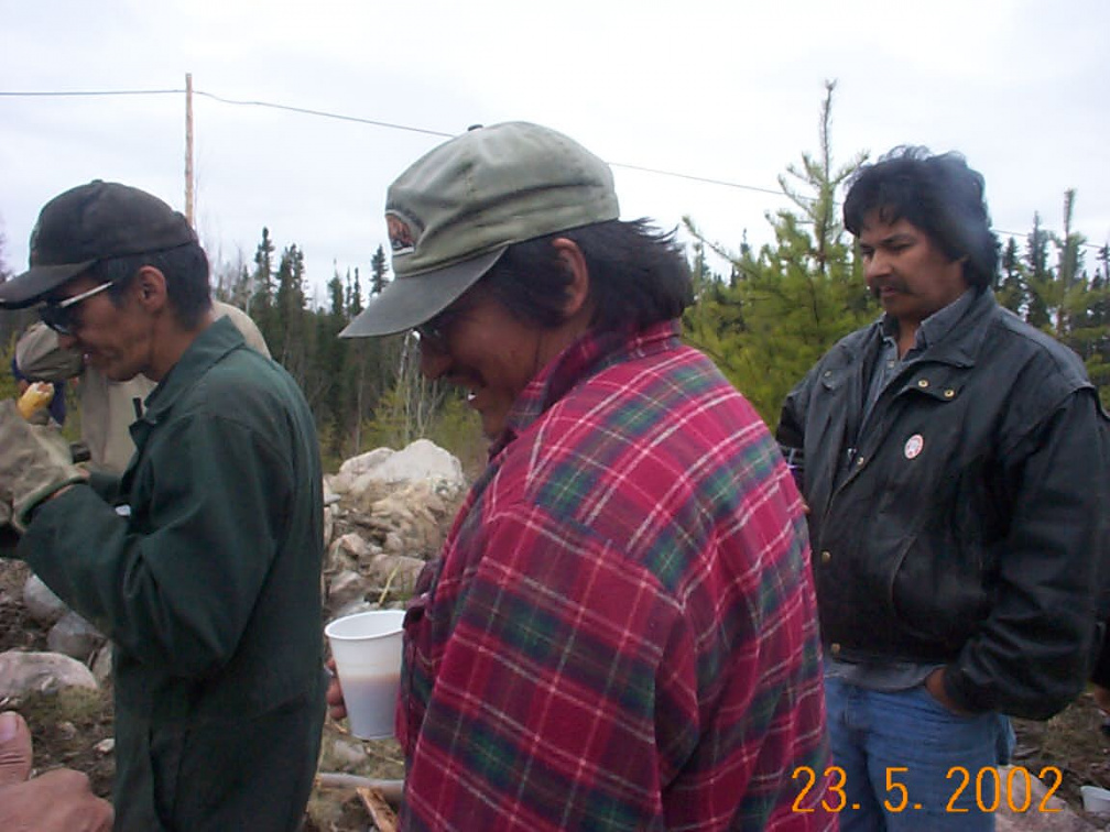 Marvin Meekis, Roland Pemmican and Bruce Rae looking at all that food